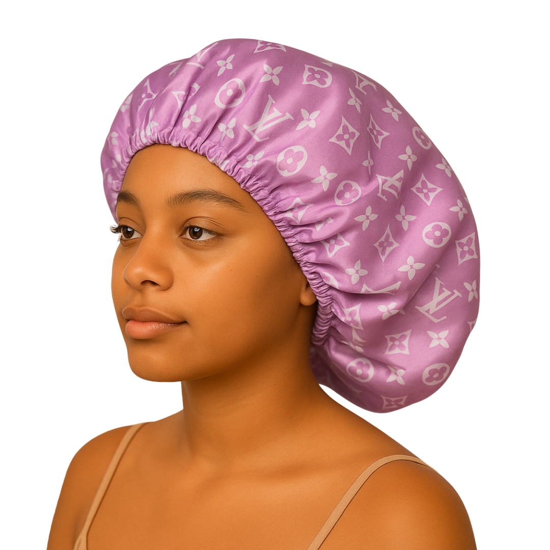 Person wearing a purple satin bonnet with a pattern on a white background