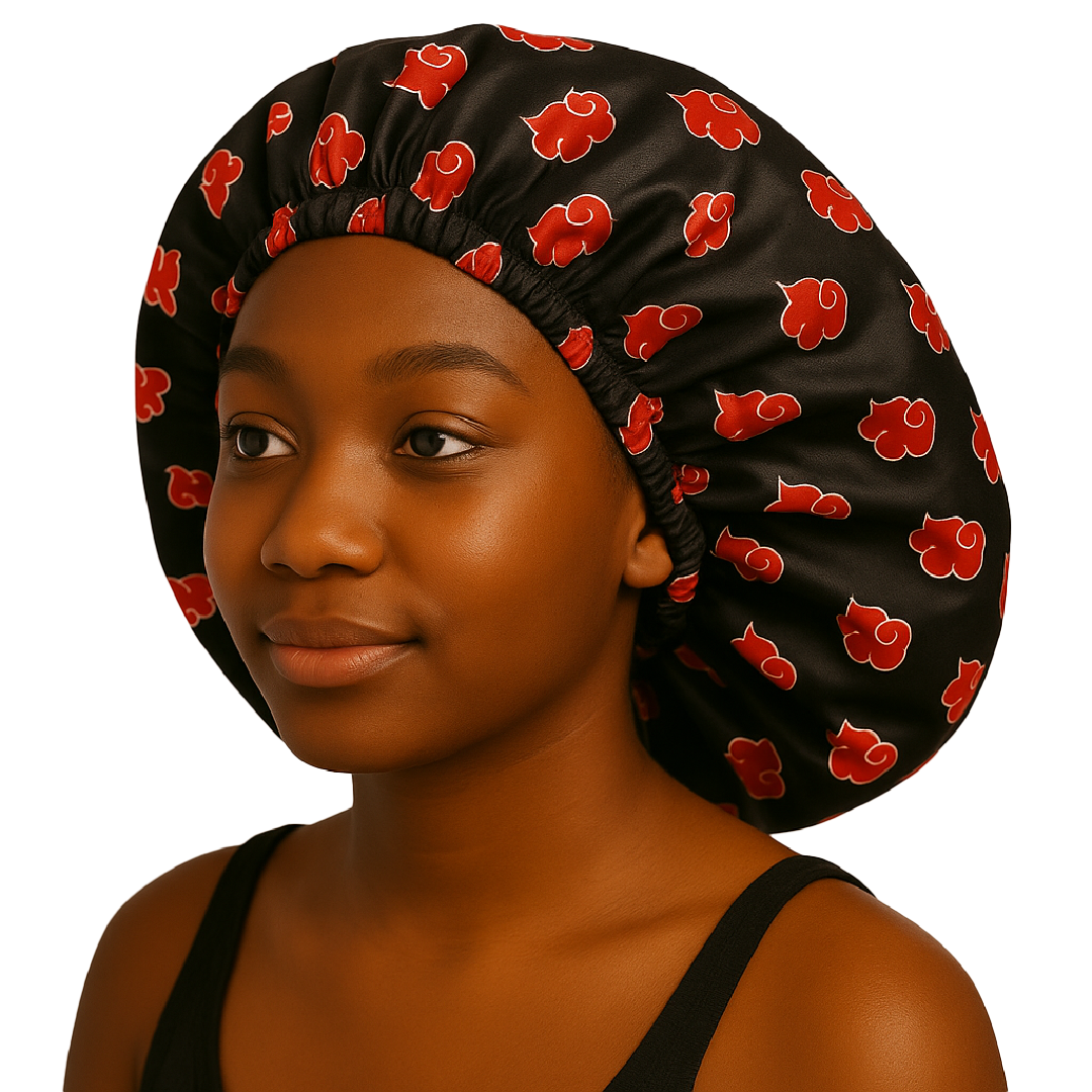 Young woman wearing Red Cloud - Silky Crown Bonnet with black and red pattern designed for hair care.